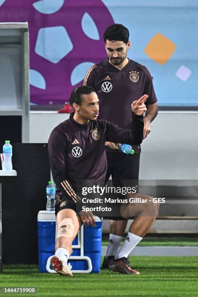 Leroy Sane and Ilkay Guendogan in a conversation during the Germany training session at Al Shamal Stadium on November 25, 2022 in Al Ruwais, Qatar.