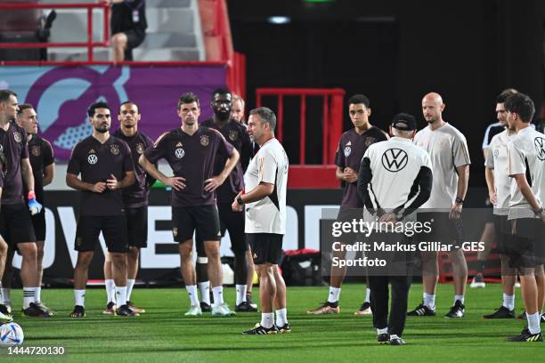 Head Coach Hansi Flick talks to the team during the Germany training session at Al Shamal Stadium on November 25, 2022 in Al Ruwais, Qatar.