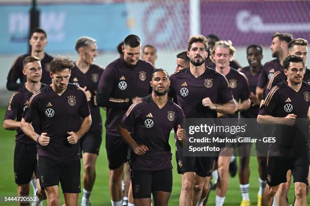 Leon Goretzka, Serge Gnabry, Kevin Trapp and Jonas Hofmann warm up during the Germany training session at Al Shamal Stadium on November 25, 2022 in...