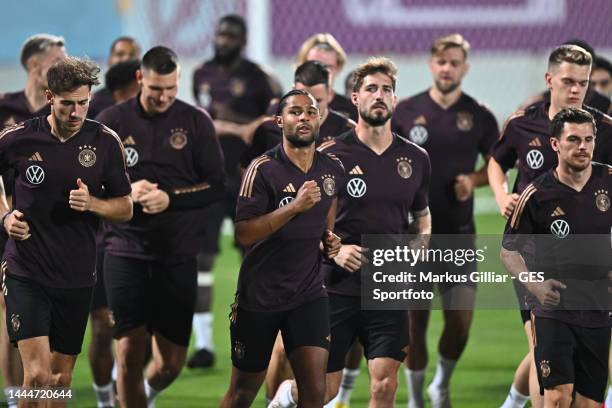 Leon Goretzka, Serge Gnabry, Kevin Trapp and Jonas Hofmann warm up during the Germany training session at Al Shamal Stadium on November 25, 2022 in...