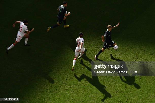 Riley McGree of Australia controls the ball against Ellyes Skhiri of Tunisia during the FIFA World Cup Qatar 2022 Group D match between Tunisia and...