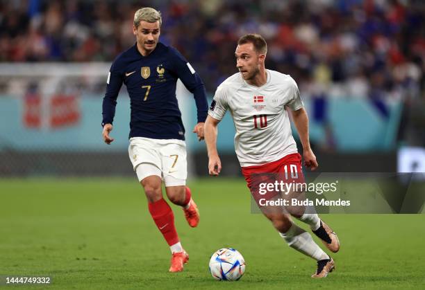 Christian Eriksen of Denmark controls the ball against Antoine Griezmann of France during the FIFA World Cup Qatar 2022 Group D match between France...