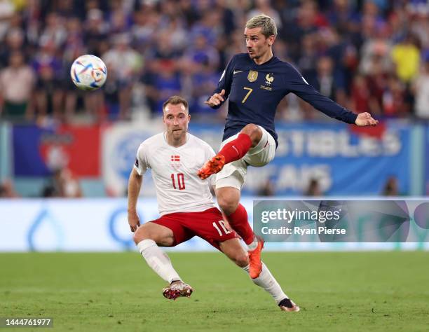 Antoine Griezmann of France controls the ball against Christian Eriksen of Denmark during the FIFA World Cup Qatar 2022 Group D match between France...