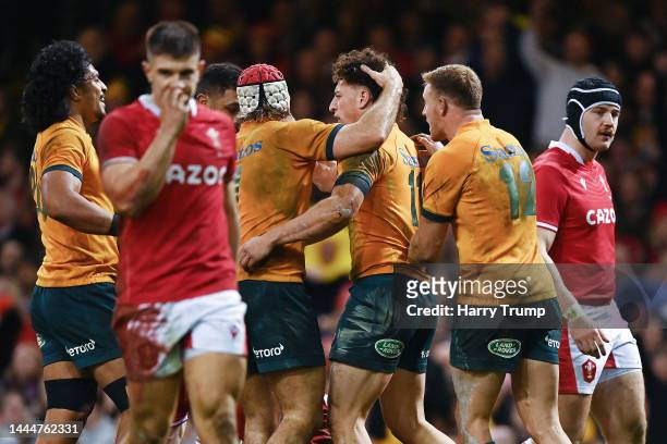 Mark Nawaqanitawase of Australia celebrates after scoring their side's third try with Fraser McReight during the Autumn International match between...