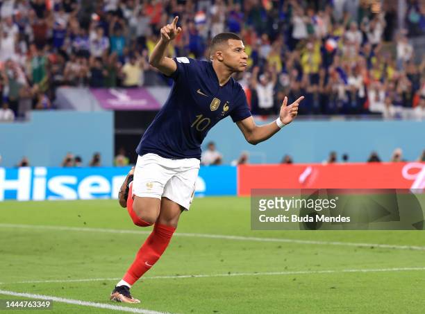 Kylian Mbappe of France celebrates after scoring their team's first goal during the FIFA World Cup Qatar 2022 Group D match between France and...