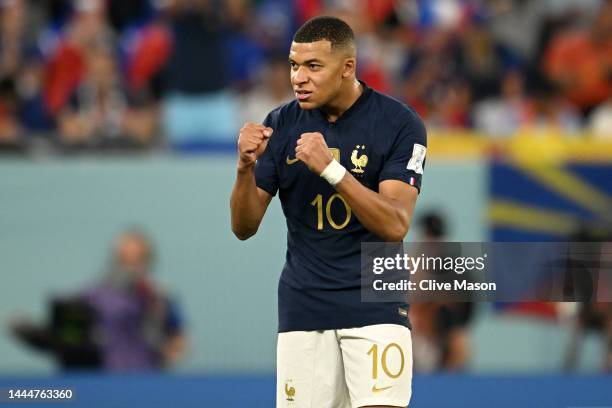 Kylian Mbappe of France celebrates after scoring their team's first goal during the FIFA World Cup Qatar 2022 Group D match between France and...