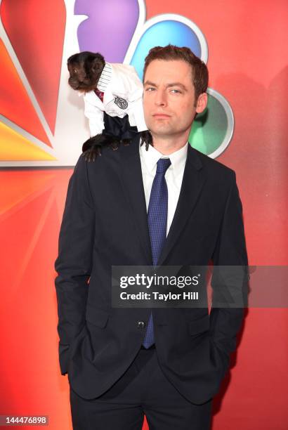 Crystal the Capuchin monkey and actor Justin Kirk attend NBC's Upfront Presentation at 51st Street on May 14, 2012 in New York City.