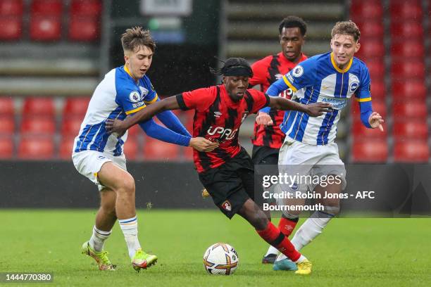 Dominic Sadi of Bournemouth squeezes between Jack Hinshlewood and Casper Nilsson of Brighton & Hove Albion during the Premier League Cup match...