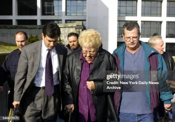 Janet Pelosi, Daniel Pelosi's mother, is escorted from court by Edward Burke , a family lawyer, and son Robert Pelosi, after the jury found her other...