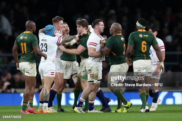 Tom Curry of England clashes with Bongi Mbonambi of South Africa during the Autumn International match between England and South Africa at Twickenham...