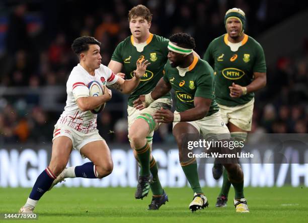 Marcus Smith of England runs with the ball during the Autumn International match between England and South Africa at Twickenham Stadium on November...