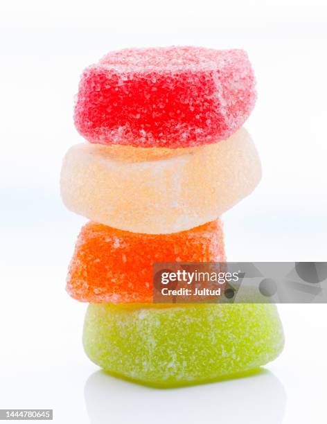 tower of sugared jelly beans on a white background - jellybean stock pictures, royalty-free photos & images