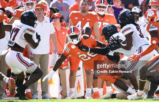 Phil Mafah of the Clemson Tigers fumbles the ball against the South Carolina Gamecocks in the second quarter at Memorial Stadium on November 26, 2022...