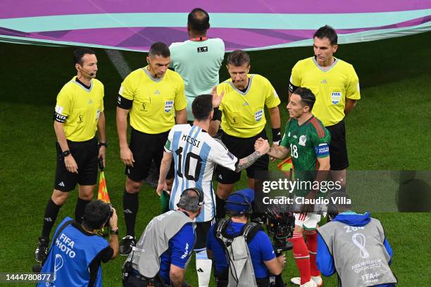 Captains Lionel Messi of Argentina and Andres Guardado of Mexico shake hands at the coin toss prior to the FIFA World Cup Qatar 2022 Group C match...