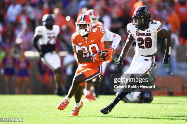 Beaux Collins of the Clemson Tigers runs the ball against Darius Rush of the South Carolina Gamecocks in the second quarter at Memorial Stadium on...