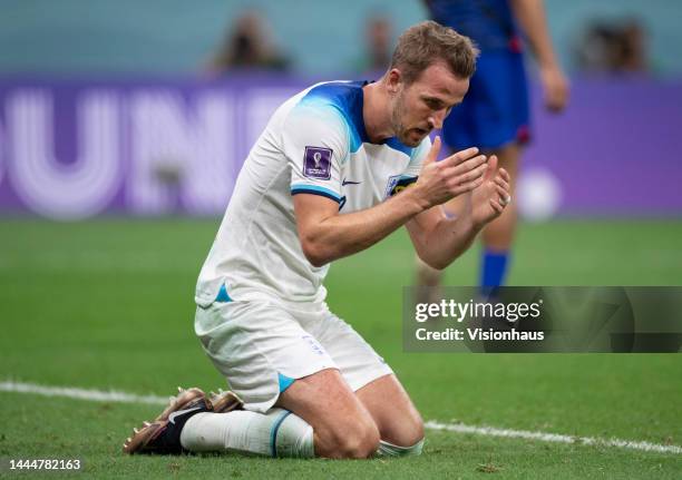 Harry Kane of England goes down on his knees dejected after missing a goal scoring opportunity during the FIFA World Cup Qatar 2022 Group B match...