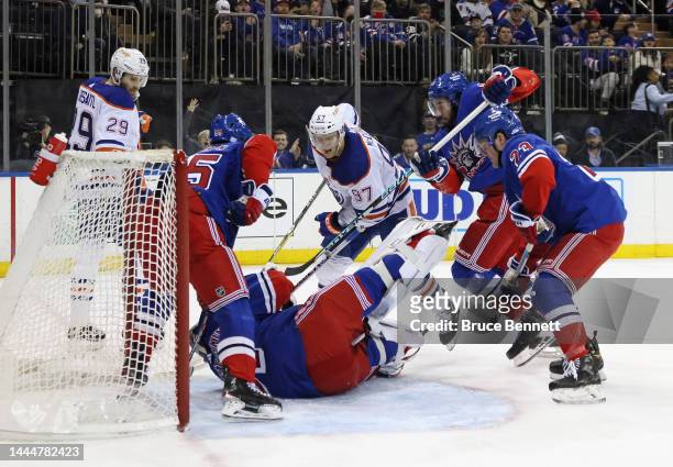 Igor Shesterkin and the New York Rangers defend against Leon Draisaitl and Connor McDavid of the Edmonton Oilers at Madison Square Garden on November...