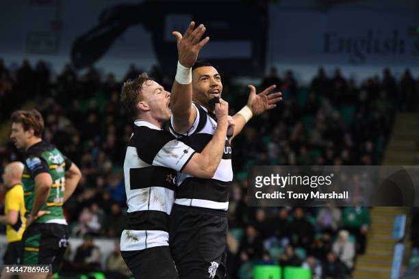 Luther Burrell of Barbarians celebrates scoring a try during the friendly match between Northampton Saints and Barbarians at Franklin's Gardens on...