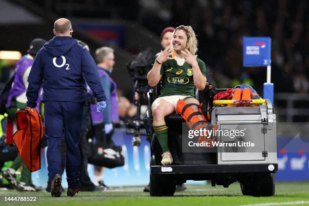 Faf de Klerk of South Africa leaves the pitch wearing a leg brace during the Autumn International match between England and South Africa at...