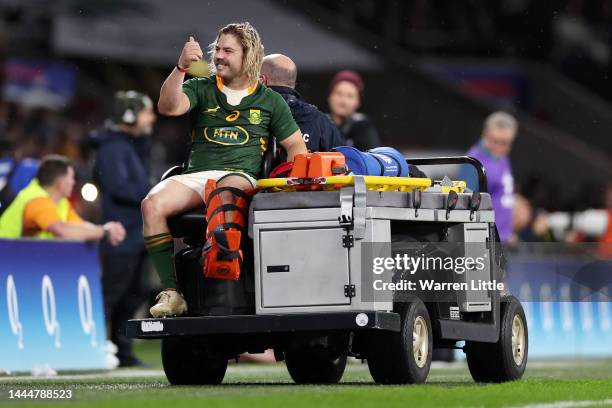 Faf de Klerk of South Africa leaves the pitch wearing a leg brace during the Autumn International match between England and South Africa at...