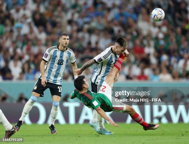 Hirving Lozano of Mexico battles for possession with Lisandro Martinez of Argentina during the FIFA World Cup Qatar 2022 Group C match between...