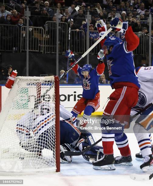 Artemi Panarin and Mika Zibanejad of the New York Rangers celebrate a second period goal by Chris Kreider against Jack Campbell of the Edmonton...