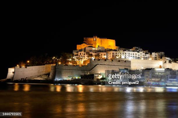 night view of peñiscola with its illuminated castle on top. - costa_del_azahar stock pictures, royalty-free photos & images