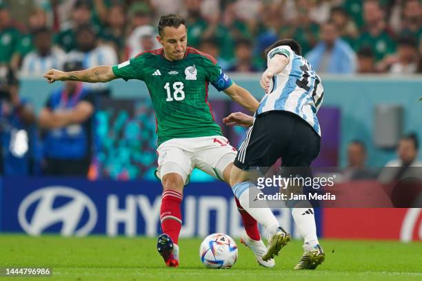 Andres Guardado of Mexico fights for the ball with Lionel Messi of Argentina during the FIFA World Cup Qatar 2022 Group C match between Argentina and...