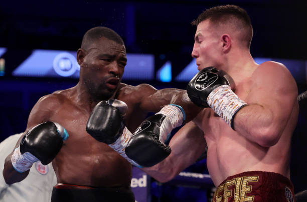 Pierce O'Lary of Ireland exchanges punches with Emmanuel Mungandjela of Namibia during the WBC International Commonwealth Super Lightweight title...