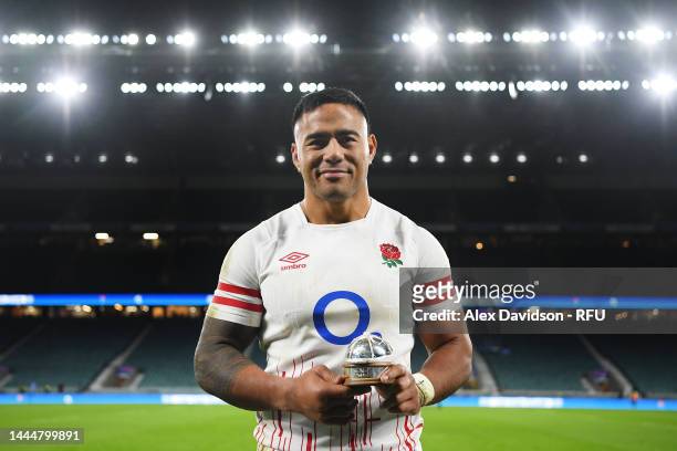 Manu Tuilagi of England poses for a photograph with their 50th cap after the Autumn International match between England and South Africa at...