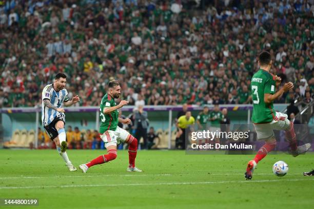 Lionel Messi of Argentina scores their team's first goal during the FIFA World Cup Qatar 2022 Group C match between Argentina and Mexico at Lusail...