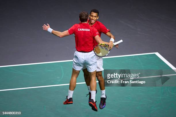 Felix Auger-Aliassime and Vasek Pospisil of Canada celebrate after winning the Davis Cup by Rakuten Finals 2022 Semifinal doubles match between Italy...