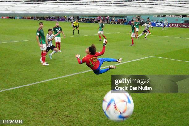 Enzo Fernandez of Argentina scores their team's second goal past Guillermo Ochoa of Mexico during the FIFA World Cup Qatar 2022 Group C match between...