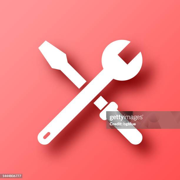 tools - wrench and screwdriver. icon on red background with shadow - red spanner stock illustrations