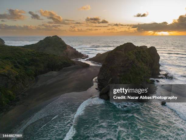 overhead view of sunset at beach. - waitakere city stock pictures, royalty-free photos & images