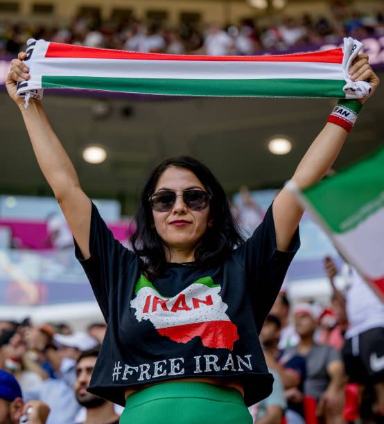 Female fan of Iran support the team during the FIFA World Cup Qatar 2022 Group B match between Wales and Iran at Ahmad Bin Ali Stadium on November...