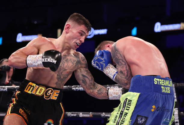 Sam Noaks of Great Britain exchanges punches with Calvin McCord of Scotland during their WB International Commonwealth Lightweightweight title fight...