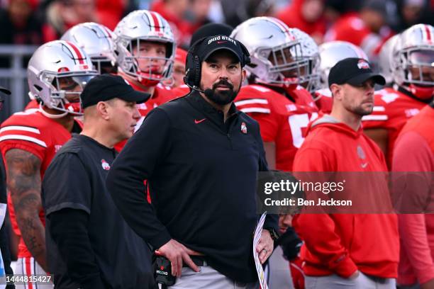 Head coach Ryan Day of the Ohio State Buckeyes watches a replay during the fourth quarter of a game against the Michigan Wolverines at Ohio Stadium...