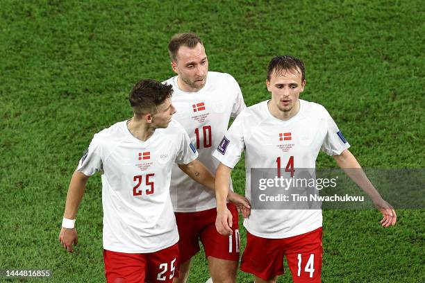 Jesper Lindstrom, Christian Eriksen and Mikkel Damsgaard of Denmark speak during the FIFA World Cup Qatar 2022 Group D match between France and...
