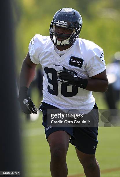 Defensive end Greg Scruggs of the Seattle Seahawks warms up during minicamp at the Virginia Mason Athletic Center on May 11, 2012 in Renton,...