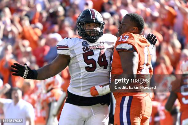 Tyler Davis of the Clemson Tigers and Jovaughn Gwyn of the South Carolina Gamecocks push each other around after a play in the second quarter at...