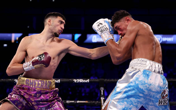 Hamzah Sheeraz of Great Britain exchanges punches with River Wilson Bent of Great Britain during their Commonwealth Middleweight fight at The O2...
