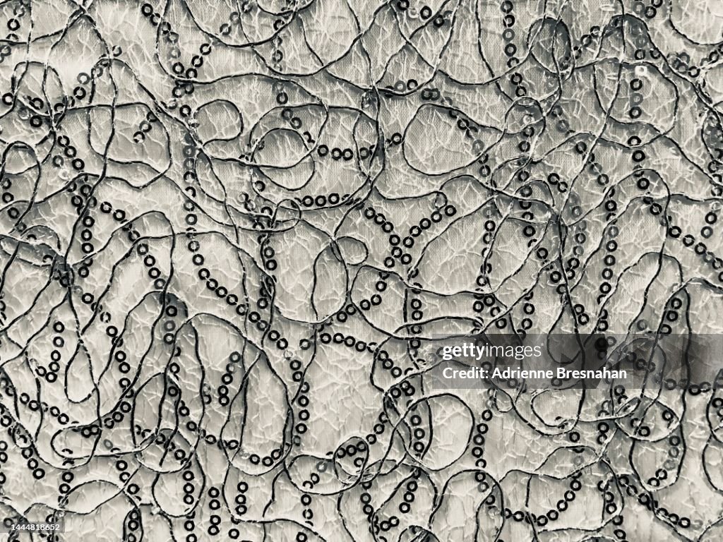 Swril Thread Swirl Sequins And Thread Pattern On Gray Fabric High-Res Stock Photo ...
