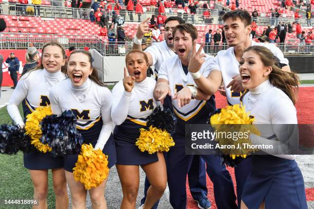Cheerleaders from the Michigan Wolverines celebrate after a college football game against the Ohio State Buckeyes at Ohio Stadium on November 26,...