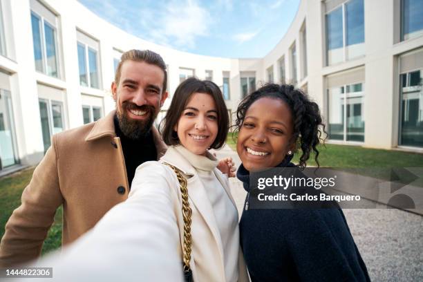 selfie of business people enjoying outdoors at work place. - three people selfie stock pictures, royalty-free photos & images