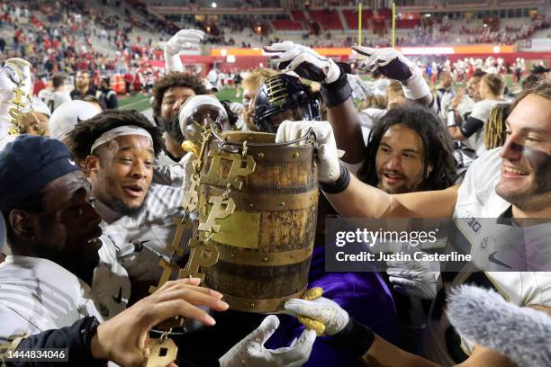 The Purdue Boilermakers celebrate winning the Old Oaken Bucket in the game over the Indiana Hoosiers at Memorial Stadium on November 26, 2022 in...