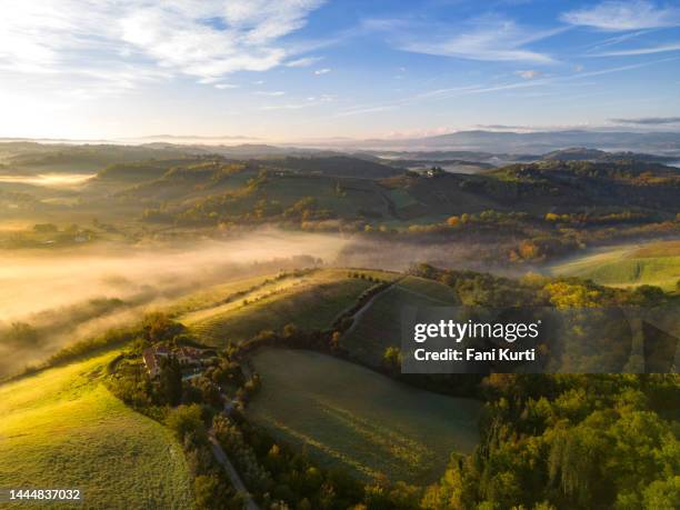 tuscan vineyard landscape with fog from drone - home golden hour stock pictures, royalty-free photos & images