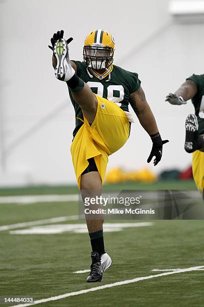 Jerel Worthy of the Green Bay Packers participates in drills during mini camp at the Don Hutson Center on May 11, 2012 in Green Bay, Wisconsin.