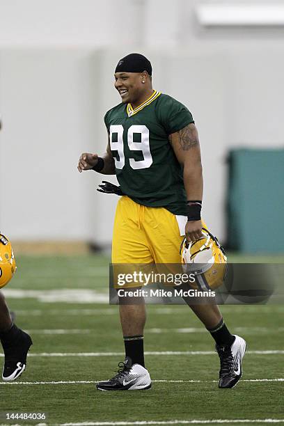 Jerel Worthy of the Green Bay Packers takes to the field during mini camp at the Don Hutson Center on May 11, 2012 in Green Bay, Wisconsin.