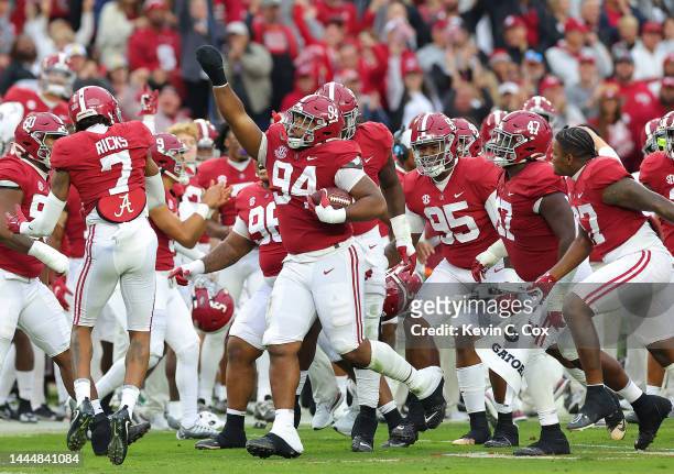 Dale of the Alabama Crimson Tide reacts after recovering a fumble by the Auburn Tigers during the first half at Bryant-Denny Stadium on November 26,...